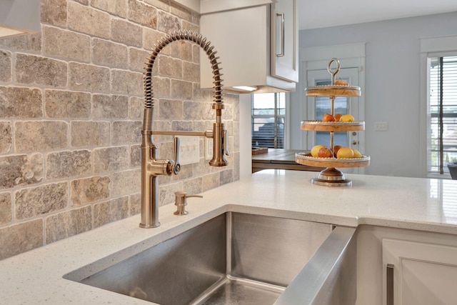 175 Dobson Knob Trl, Nolensville, TN 37135 - kitchen view of white cabinets, light stone counters, and a sink