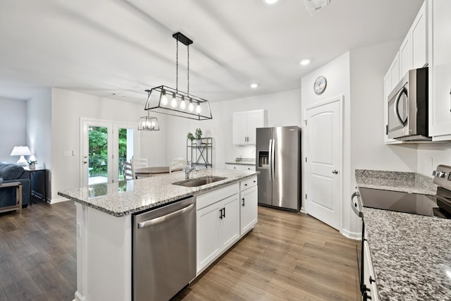 207 Addison Ave, Chapel Hill, TN 37034 - kitchen featuring stainless steel appliances, wood finished floors, recessed lighting, a center island with sink, and white cabinets