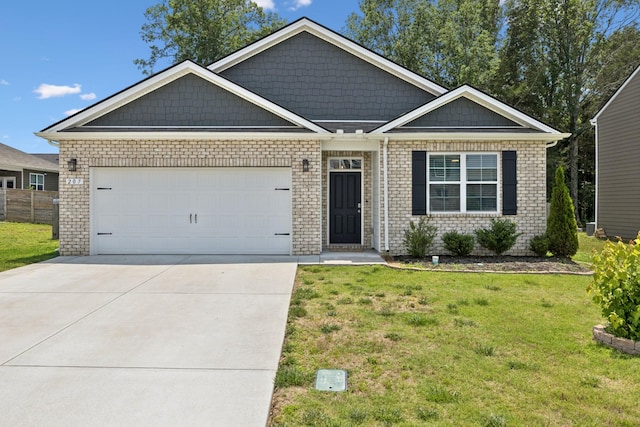 207 Addison Ave, Chapel Hill, TN 37034 - view of front of home with a front lawn, a garage, driveway, and brick siding