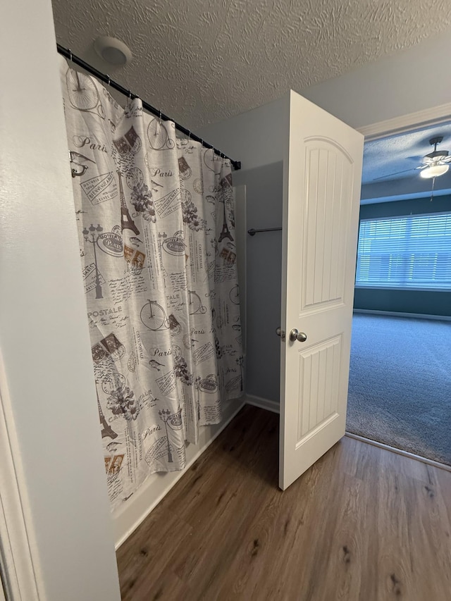 412 Moshe Mualem Pl, La Vergne, TN 37086 - full bath with wood finished floors, a textured ceiling, and curtained shower