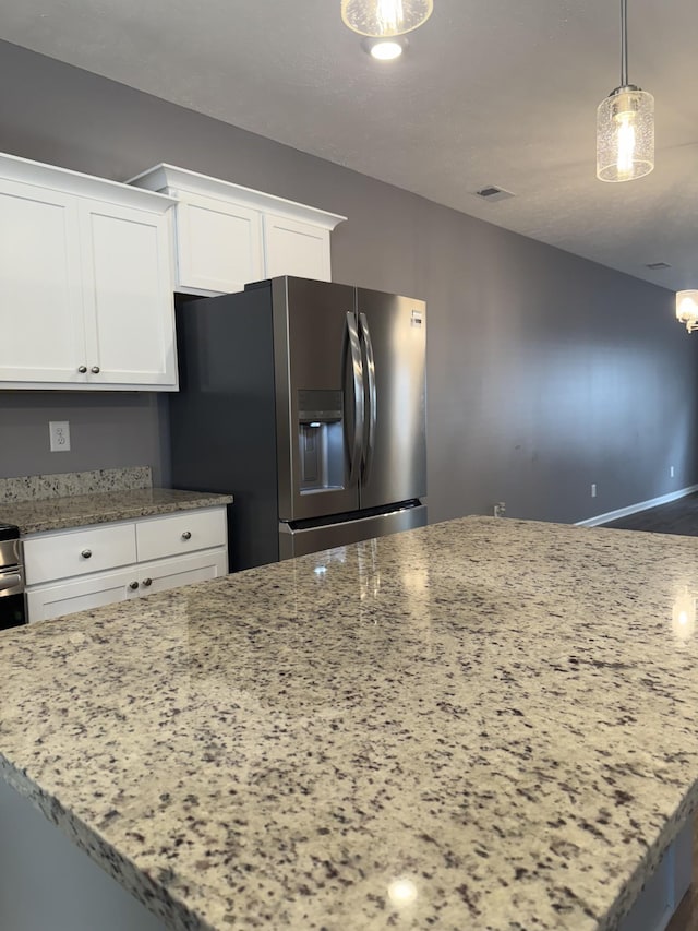 412 Moshe Mualem Pl, La Vergne, TN 37086 - kitchen featuring stainless steel fridge with ice dispenser, light stone countertops, white cabinets, and pendant lighting