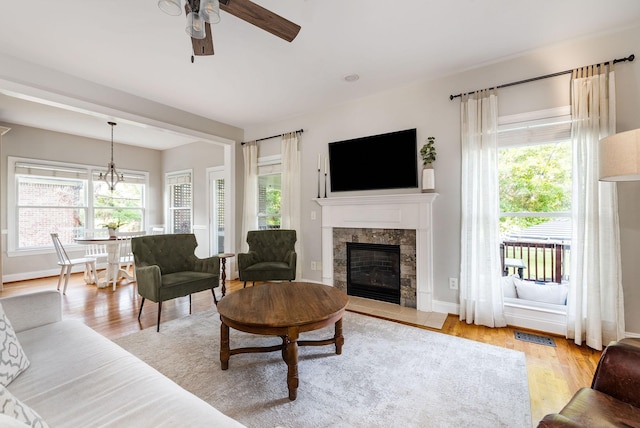 113 Joshuas Run, Goodlettsville, TN 37072 - living area with healthy amount of natural light, ceiling fan, a tile fireplace, and light wood-style floors