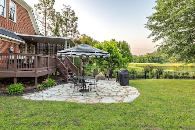 113 Joshuas Run, Goodlettsville, TN 37072 - yard at dusk with a patio area and a wooden deck