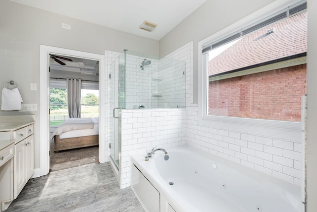 113 Joshuas Run, Goodlettsville, TN 37072 - bathroom featuring a shower stall, wood finished floors, a whirlpool tub, connected bathroom, and vanity