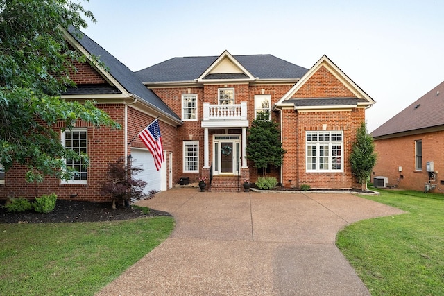 113 Joshuas Run, Goodlettsville, TN 37072 - georgian-style home featuring driveway, a balcony, cooling unit, brick siding, and a front lawn
