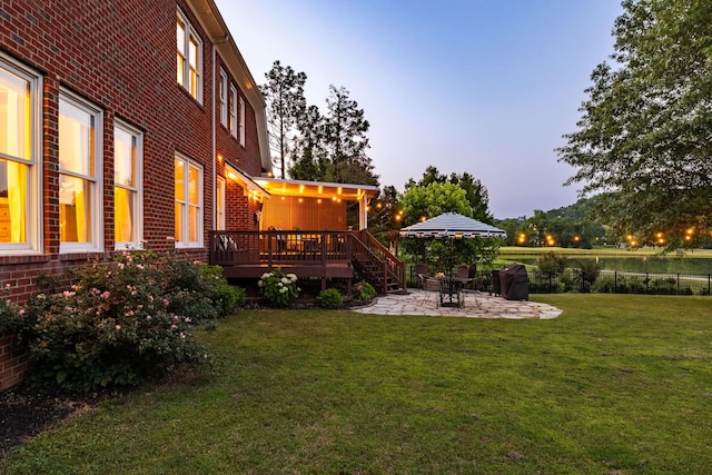 113 Joshuas Run, Goodlettsville, TN 37072 - yard at dusk with a deck and a patio