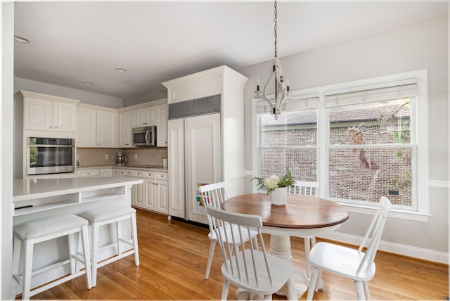 113 Joshuas Run, Goodlettsville, TN 37072 - dining area with light wood finished floors and a chandelier