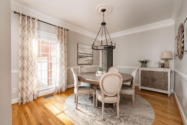 113 Joshuas Run, Goodlettsville, TN 37072 - dining room featuring a chandelier, wood finished floors, ornamental molding, and baseboards