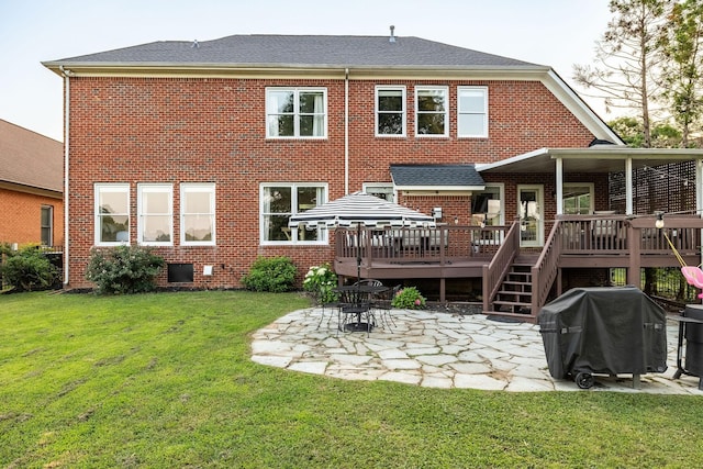 113 Joshuas Run, Goodlettsville, TN 37072 - back of house with a patio area, brick siding, a deck, and a lawn
