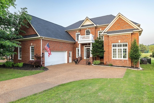 113 Joshuas Run, Goodlettsville, TN 37072 - colonial-style house with a balcony, brick siding, driveway, a shingled roof, and a front lawn