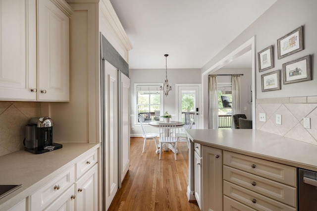 113 Joshuas Run, Goodlettsville, TN 37072 - kitchen with light countertops, decorative backsplash, light wood finished floors, and hanging light fixtures