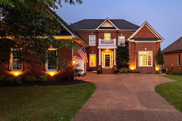 113 Joshuas Run, Goodlettsville, TN 37072 - colonial inspired home with brick siding, driveway, central AC unit, a balcony, and a front lawn