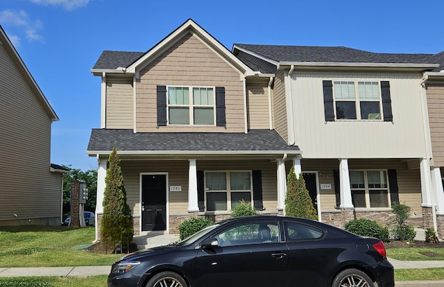 1746 Sprucedale Dr, Antioch, TN 37013 - craftsman house with stone siding, a porch, and roof with shingles