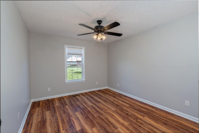 55 Bluebird Ln, Lafayette, TN 37083 - unfurnished room with dark wood-type flooring, baseboards, and ceiling fan