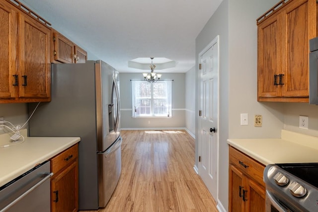 55 Bluebird Ln, Lafayette, TN 37083 - kitchen featuring stainless steel appliances and brown cabinets