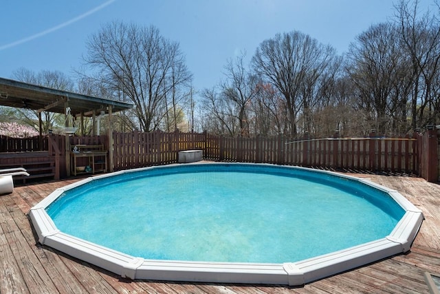 55 Bluebird Ln, Lafayette, TN 37083 - view of swimming pool featuring a deck and a fenced backyard