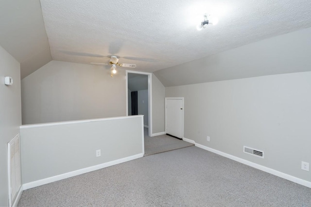 55 Bluebird Ln, Lafayette, TN 37083 - bonus room featuring lofted ceiling, ceiling fan, carpet flooring, a textured ceiling, and baseboards