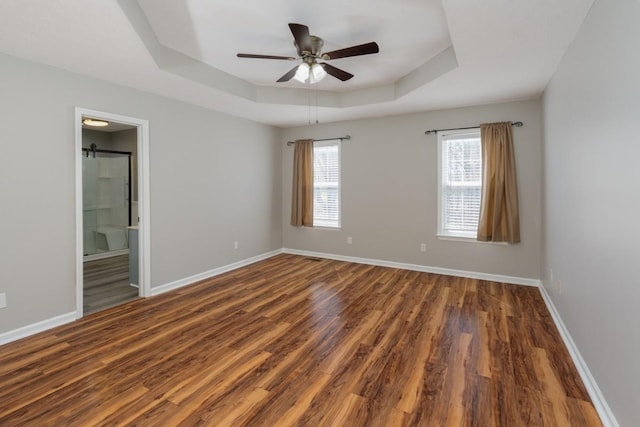 55 Bluebird Ln, Lafayette, TN 37083 - unfurnished room with a raised ceiling, wood finished floors, ceiling fan, and baseboards