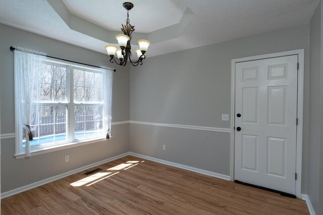 55 Bluebird Ln, Lafayette, TN 37083 - spare room with wood finished floors, a chandelier, and baseboards