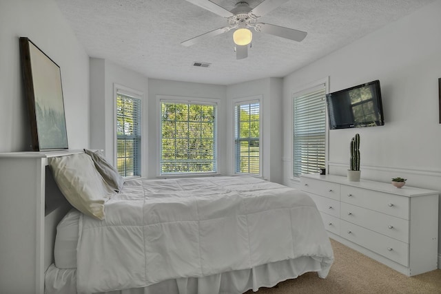 2056 Earl Pearce Cir, Mount Juliet, TN 37122 - bedroom with multiple windows, light carpet, a textured ceiling, and a ceiling fan