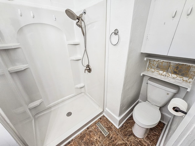 1105 Normandy Rd, Normandy, TN 37360 - full bathroom featuring a shower stall, toilet, and baseboards