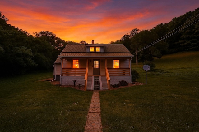1105 Normandy Rd, Normandy, TN 37360 - view of front of home with a porch, a front yard, metal roof, and a chimney