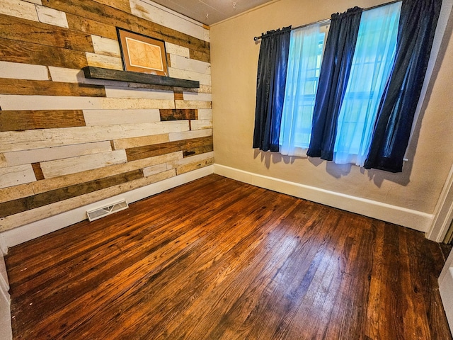 1105 Normandy Rd, Normandy, TN 37360 - unfurnished room featuring wooden walls, baseboards, and dark wood finished floors