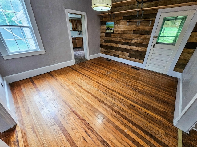 1105 Normandy Rd, Normandy, TN 37360 - unfurnished room featuring baseboards, wood finished floors, and wooden walls