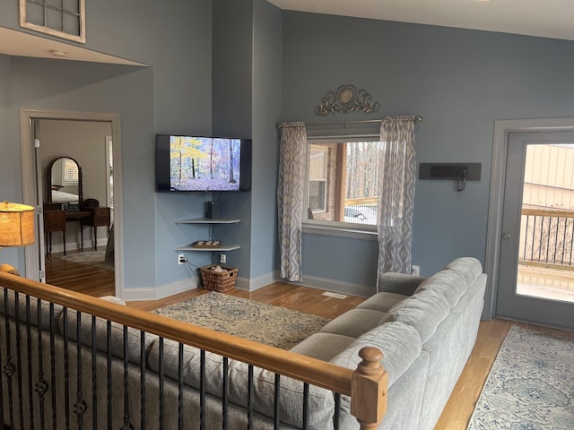 1064 Bills Ln, Joelton, TN 37080 - living room featuring wood finished floors, healthy amount of natural light, and baseboards
