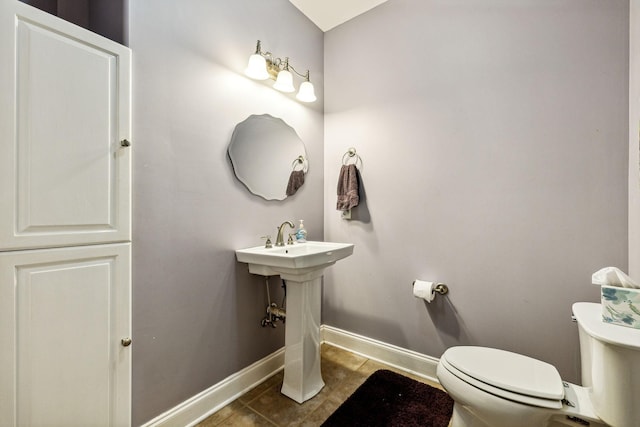 1064 Bills Ln, Joelton, TN 37080 - half bath featuring toilet, baseboards, and tile patterned flooring