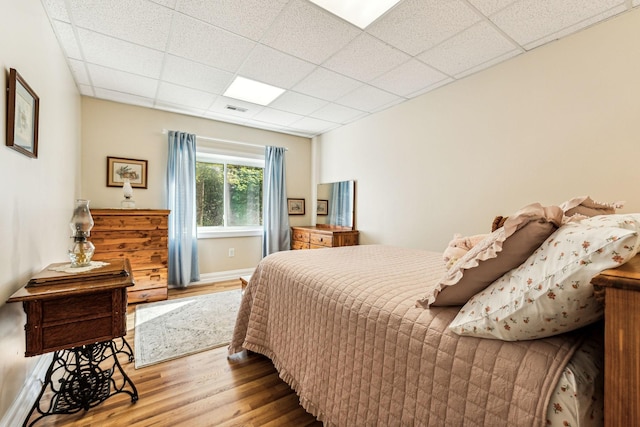 1064 Bills Ln, Joelton, TN 37080 - bedroom with wood finished floors and a paneled ceiling