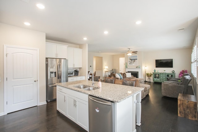8023 Forest Hills Dr, Spring Hill, TN 37174 - kitchen featuring stainless steel appliances, a sink, a ceiling fan, a center island with sink, and dark wood-type flooring