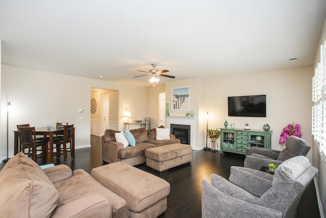 8023 Forest Hills Dr, Spring Hill, TN 37174 - living area featuring dark wood-type flooring, ceiling fan, baseboards, and a glass covered fireplace