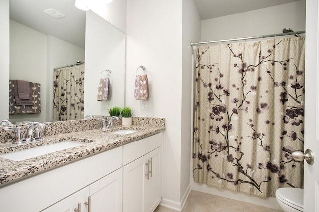 8023 Forest Hills Dr, Spring Hill, TN 37174 - full bath with toilet, double vanity, tile patterned floors, and baseboards