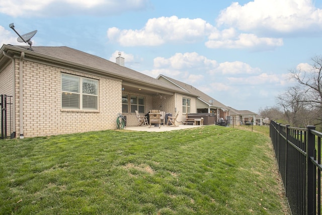 8023 Forest Hills Dr, Spring Hill, TN 37174 - back of house with a hot tub, brick siding, a patio, and a chimney