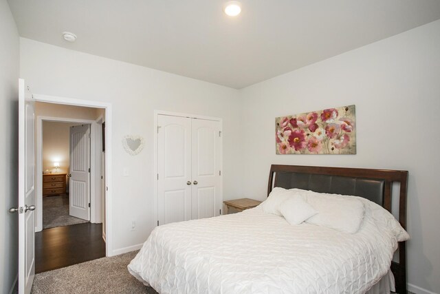 8023 Forest Hills Dr, Spring Hill, TN 37174 - bedroom featuring dark colored carpet, baseboards, and a closet