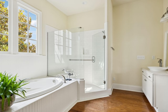 3007 General Martin Ln, Franklin, TN 37064 - full bathroom with a stall shower, a bath, vanity, wood finished floors, and baseboards