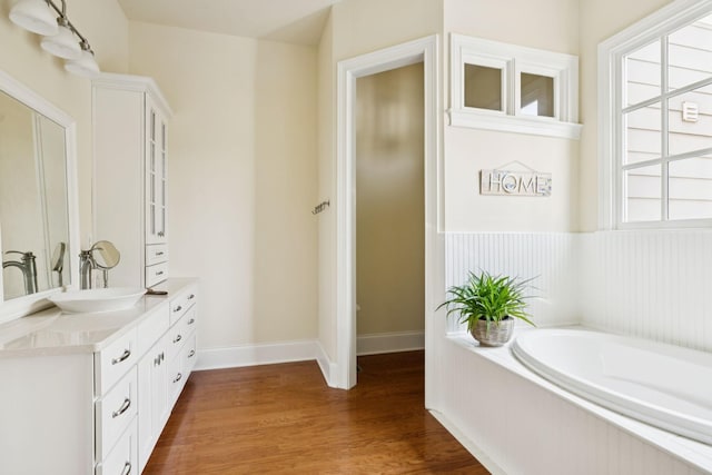 3007 General Martin Ln, Franklin, TN 37064 - full bath featuring vanity, a bath, wood finished floors, and baseboards