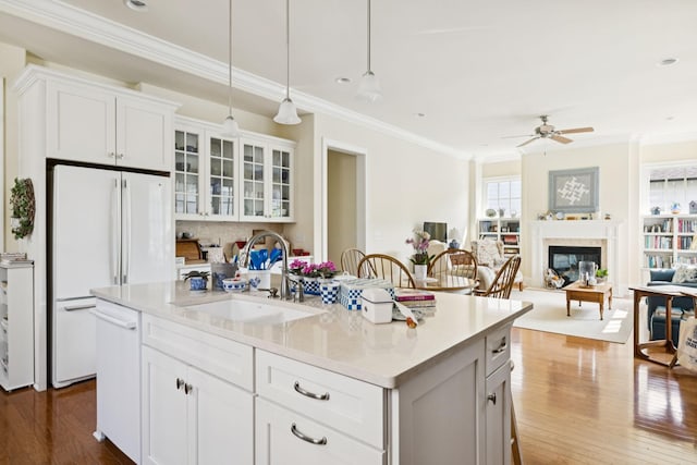 3007 General Martin Ln, Franklin, TN 37064 - kitchen featuring a sink, white appliances, ornamental molding, ceiling fan, and light countertops