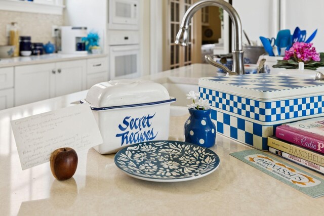 3007 General Martin Ln, Franklin, TN 37064 - detailed view of white appliances, white cabinets, and light countertops
