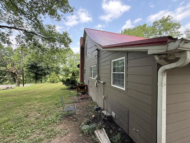 1650 E Beaverdam Rd, Centerville, TN 37033 - view of home's exterior with a lawn and metal roof