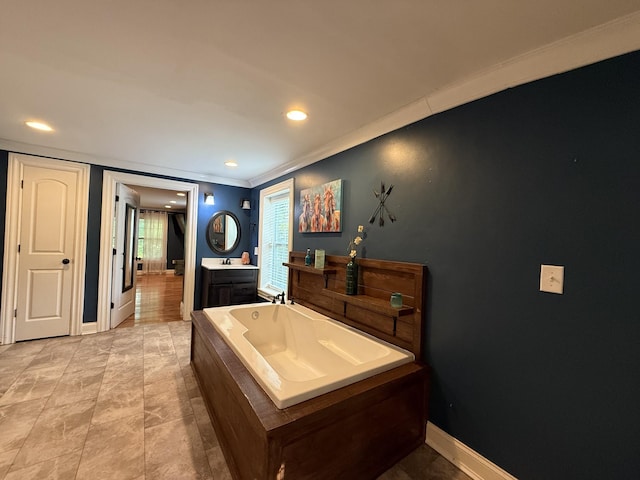1650 E Beaverdam Rd, Centerville, TN 37033 - bathroom featuring vanity, a garden tub, crown molding, baseboards, and recessed lighting
