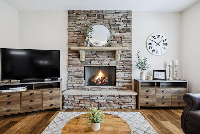 1045 Brayden Dr, Fairview, TN 37062 - living room featuring dark wood-style flooring and a stone fireplace