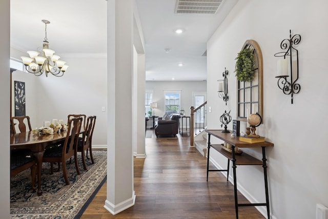 1045 Brayden Dr, Fairview, TN 37062 - dining area with a chandelier, dark wood-type flooring, recessed lighting, baseboards, and stairway