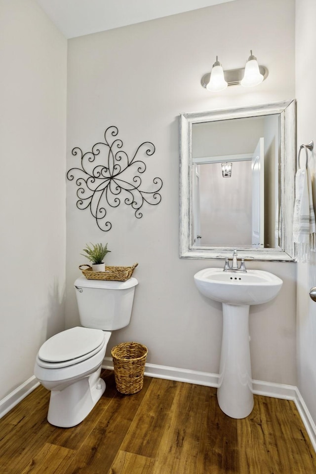 1045 Brayden Dr, Fairview, TN 37062 - bathroom with wood finished floors, toilet, and baseboards