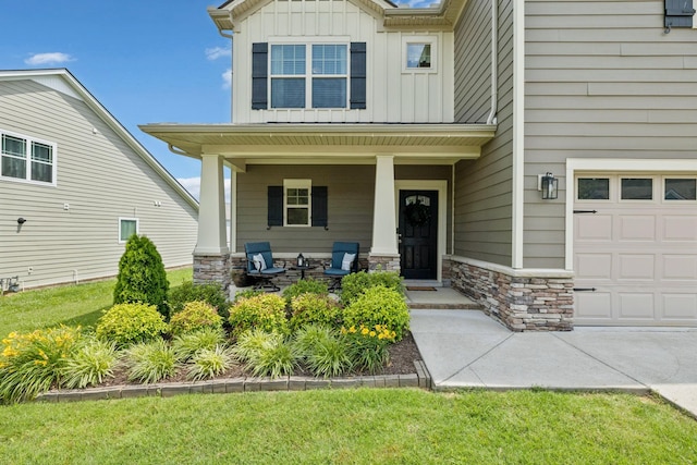 1045 Brayden Dr, Fairview, TN 37062 - property entrance with covered porch, board and batten siding, stone siding, and a garage