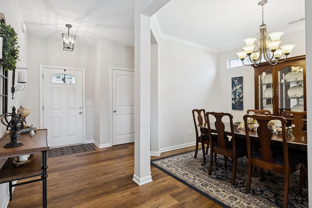 1045 Brayden Dr, Fairview, TN 37062 - foyer featuring a chandelier, dark wood-style floors, ornamental molding, and baseboards