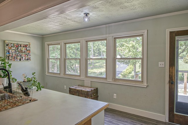 260 Fate Ivy Rd, Monterey, TN 38574 - dining space featuring dark wood-style flooring, baseboards, ornamental molding, and a textured ceiling