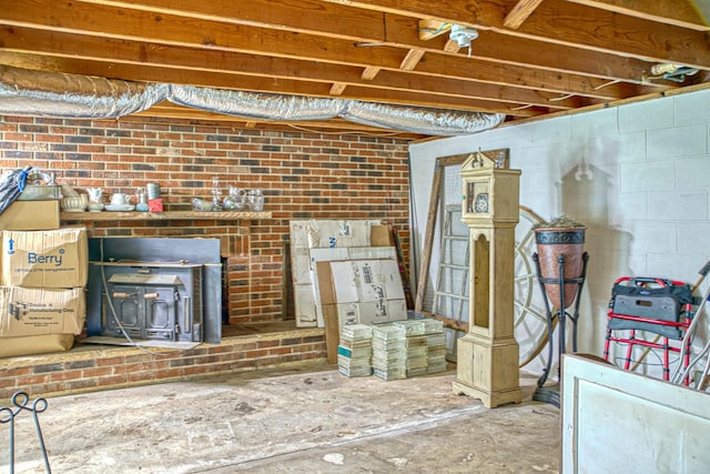 260 Fate Ivy Rd, Monterey, TN 38574 - unfinished below grade area featuring a wood stove and concrete block wall