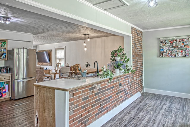260 Fate Ivy Rd, Monterey, TN 38574 - kitchen featuring freestanding refrigerator, a textured ceiling, a sink, wood finished floors, and baseboards